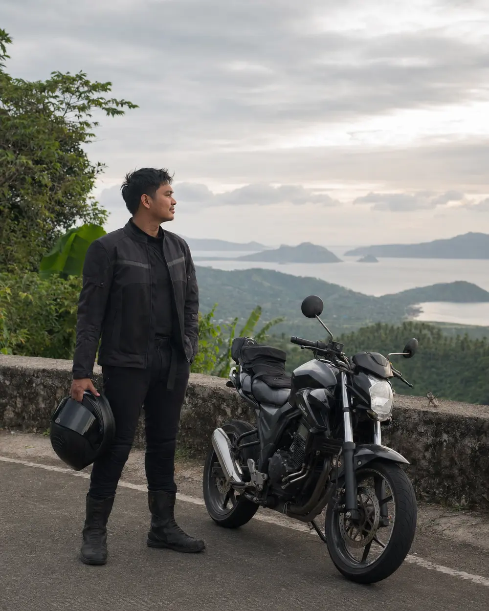 Editorial rider study at a roadside viewpoint